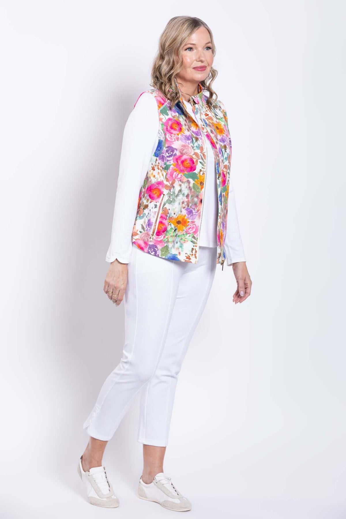 Side view of woman modeling the Hartford Pink Print Vest with floral design