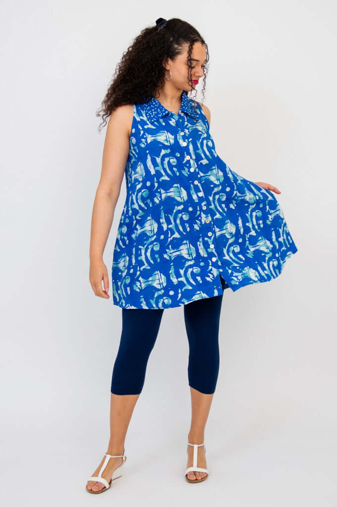 Side angle of model showing swing and fullness of blue Cissy Tank