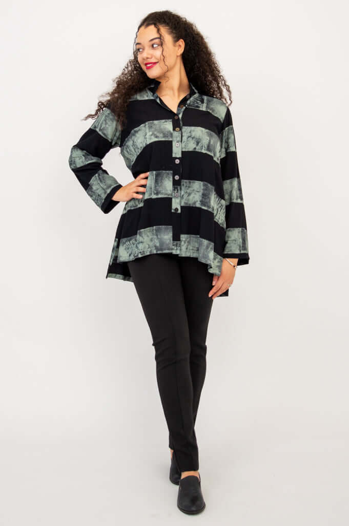 Model posing in Talina Batik Stripe Blouse, looking to the side