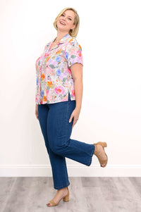 Side pose of a woman in the Samantha linen bamboo shirt and jeans