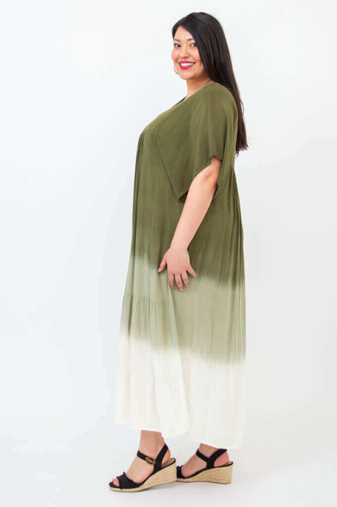 Side view of woman wearing olive ombre tiered maxi dress
