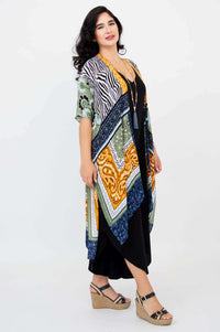 Side view of woman wearing Darcy kimono wrap displaying draped silhouette