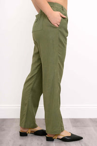 Side view of model featuring elasticized back waistband and side pocket of trousers