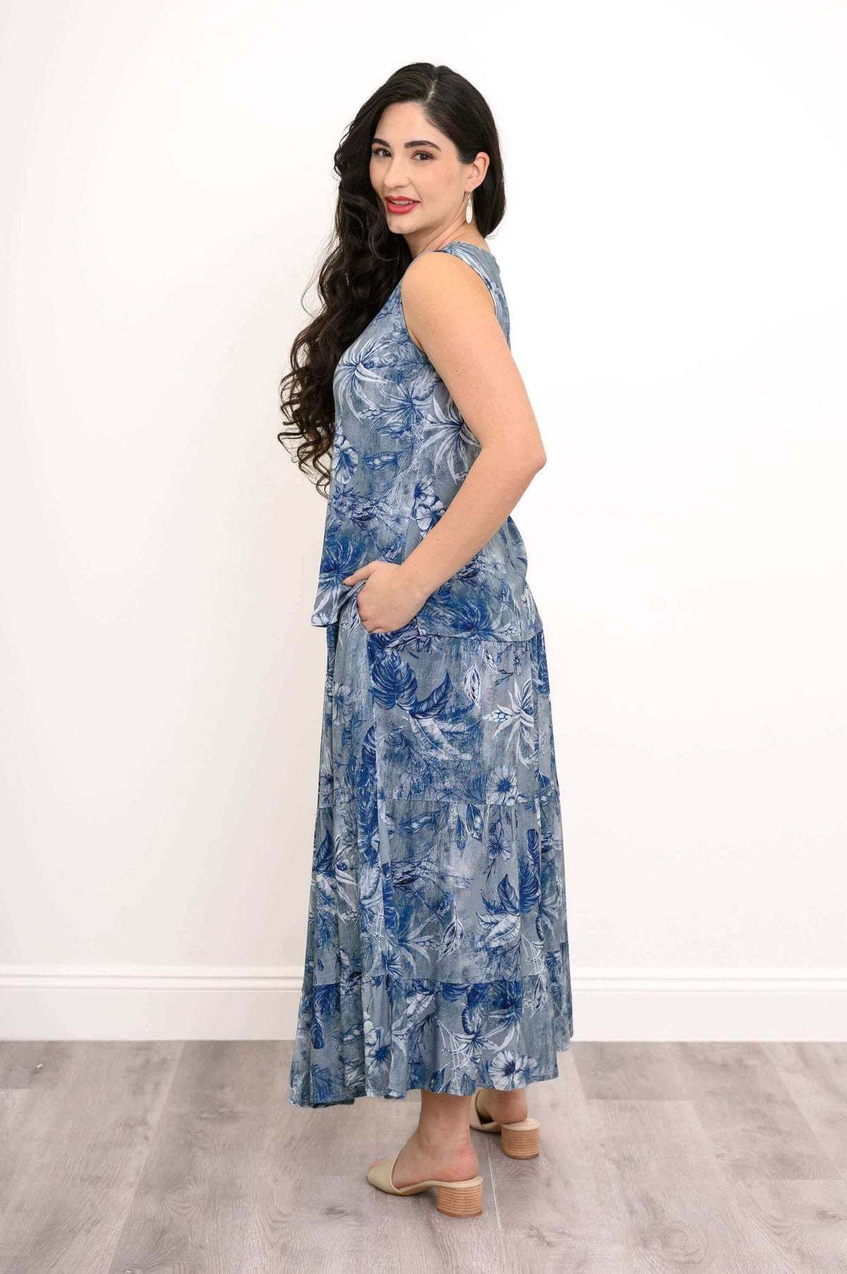Side view of blue botanical V-neck tank top and skirt outfit