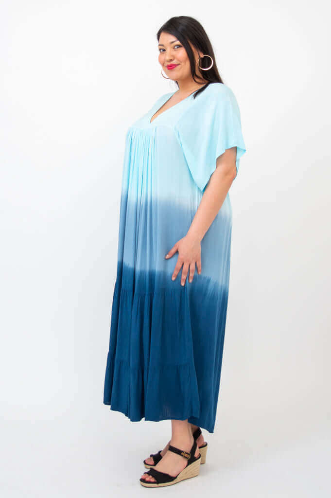 Side view of blue ombre tiered maxi dress on woman