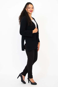 Side view of model wearing black Dallas Cardigan with long kimono sleeves
