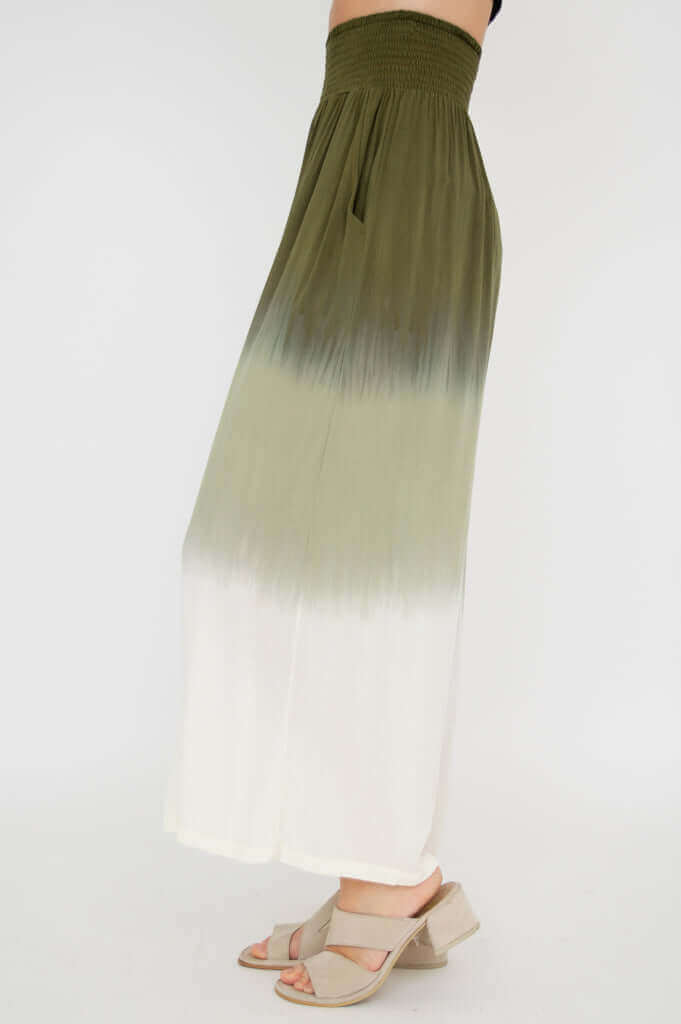 Side profile of olive ombre wide leg pants showing flowy silhouette