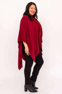 Side view of woman in scarlet wrap showcasing elegant cut