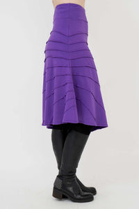 Side view of the Beverly Skirt in purple, highlighting asymmetrical design