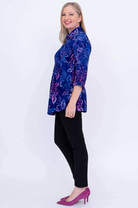 Side profile of model showcasing blue floral Cindy smocked blouse with pleats and 3/4 sleeves