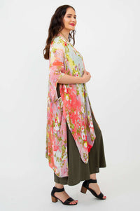 Side view of model displaying flowy hem and kimono sleeves of Darcy wrap