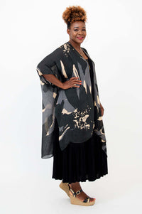 Side view of model showing kimono sleeves and drape of Darcy wrap