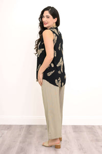 Side view of model in black and tan Hula print tank, showing curved hemline