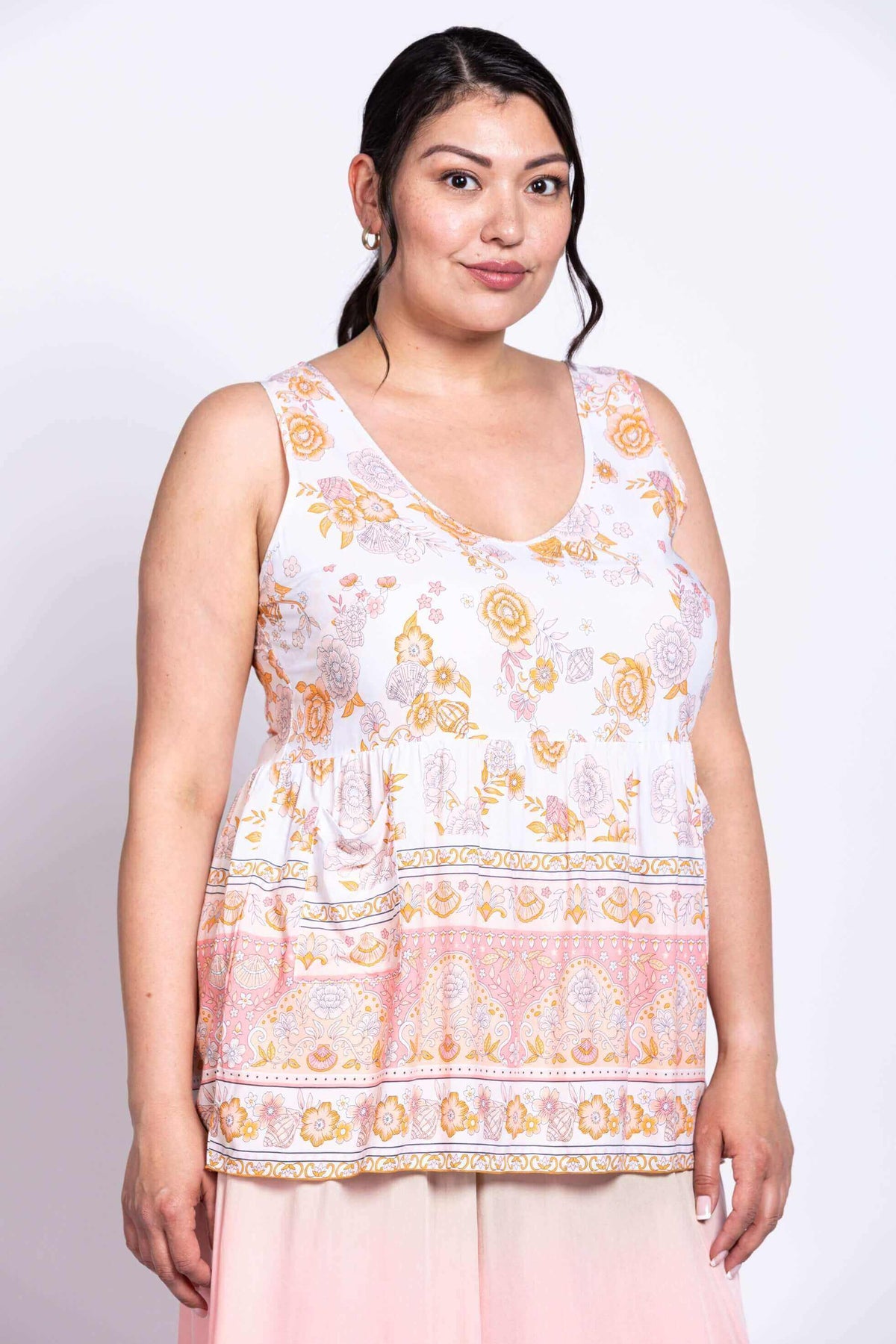 Side view of model wearing the Kaya Floral Tank Top with floral design