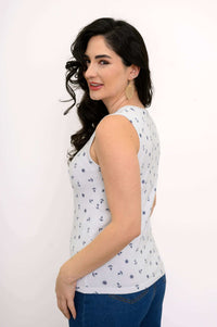 Woman in nautical tank top shown from a side angle