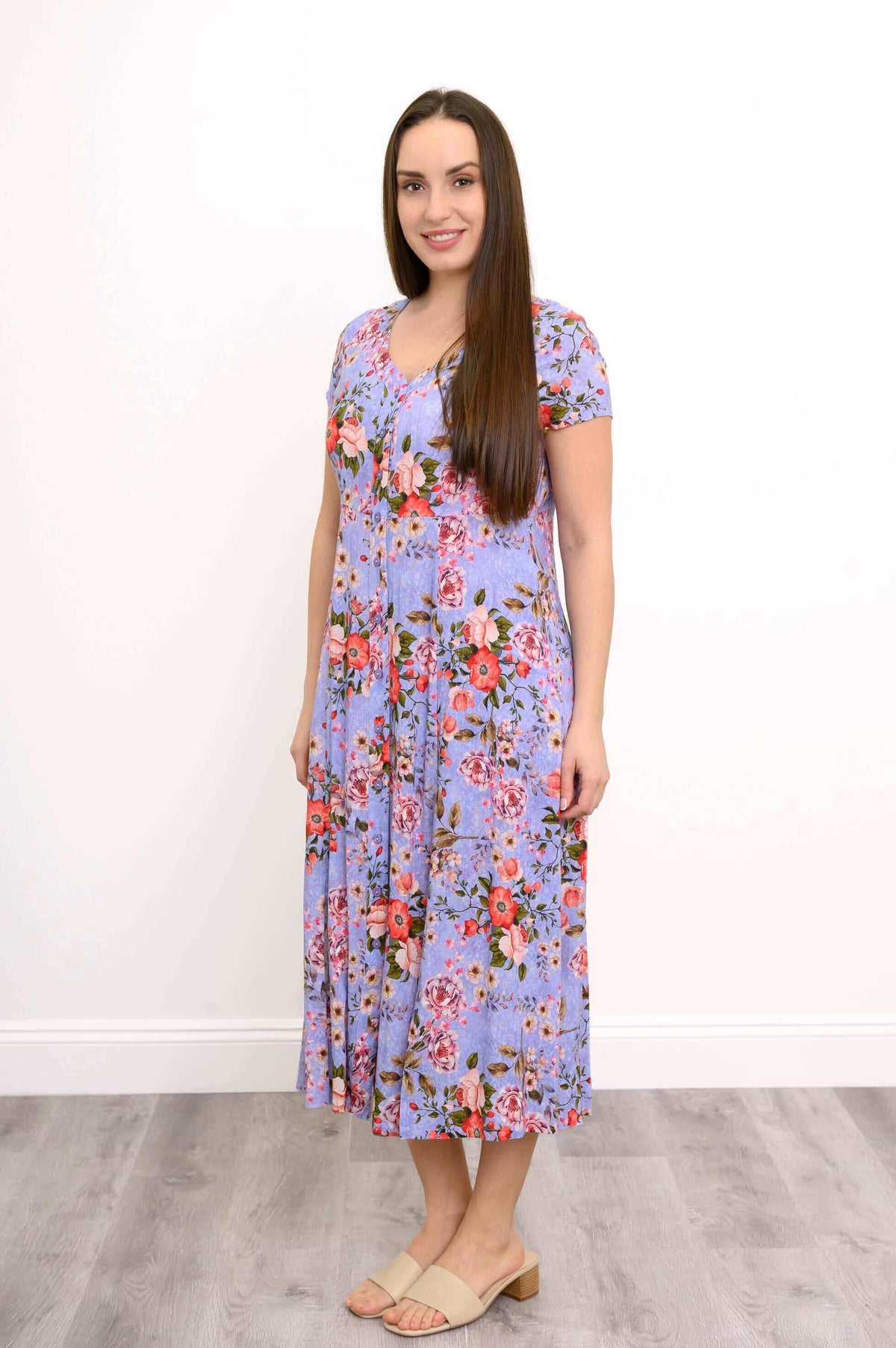 Side view of woman wearing Morgan floral print midi dress with empire waist detailing
