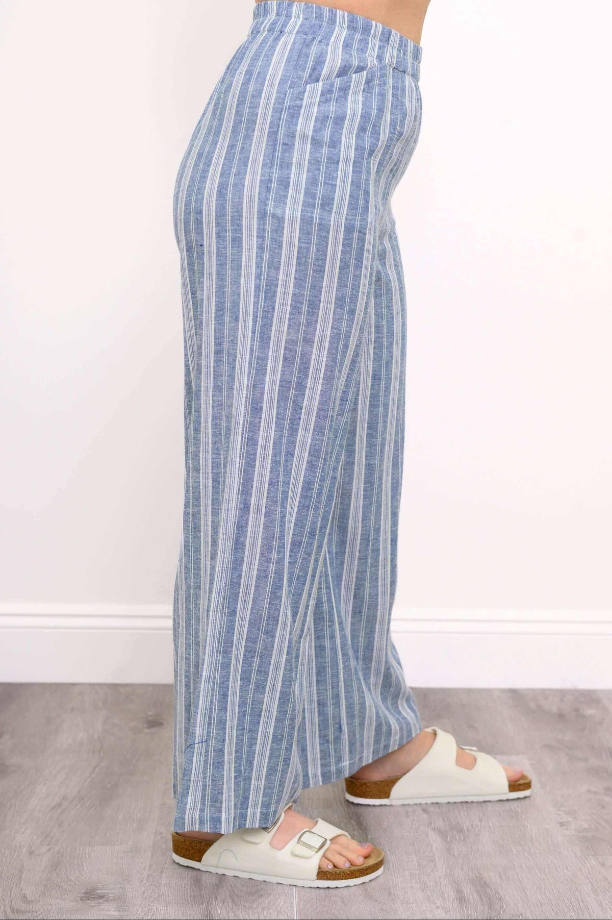 Side view of Parker Pant showing blue stripe linen-blend fabric and pocket detail