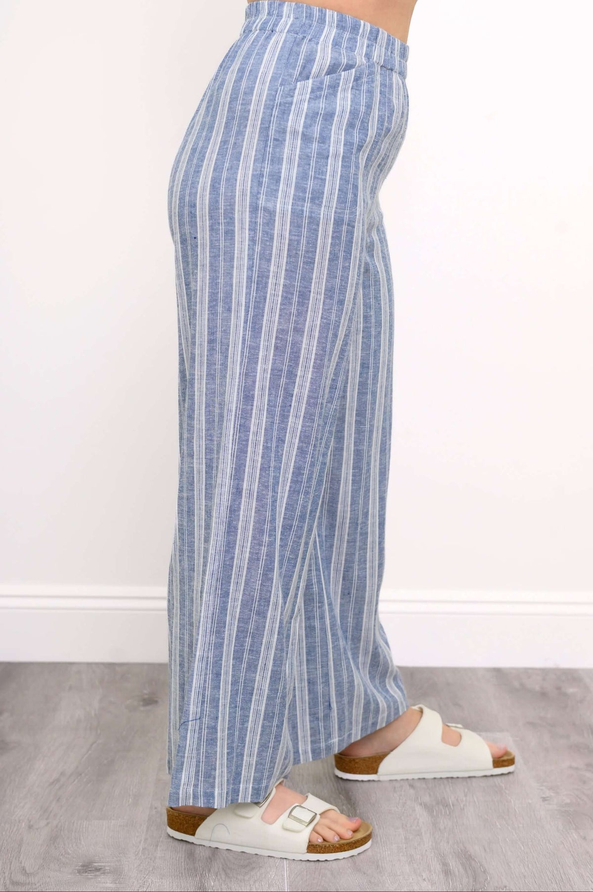 Side view of Parker blue striped wide-leg pants with relaxed fit