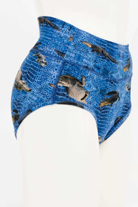 Side view of blue high-waisted alligator print women's brief on mannequin