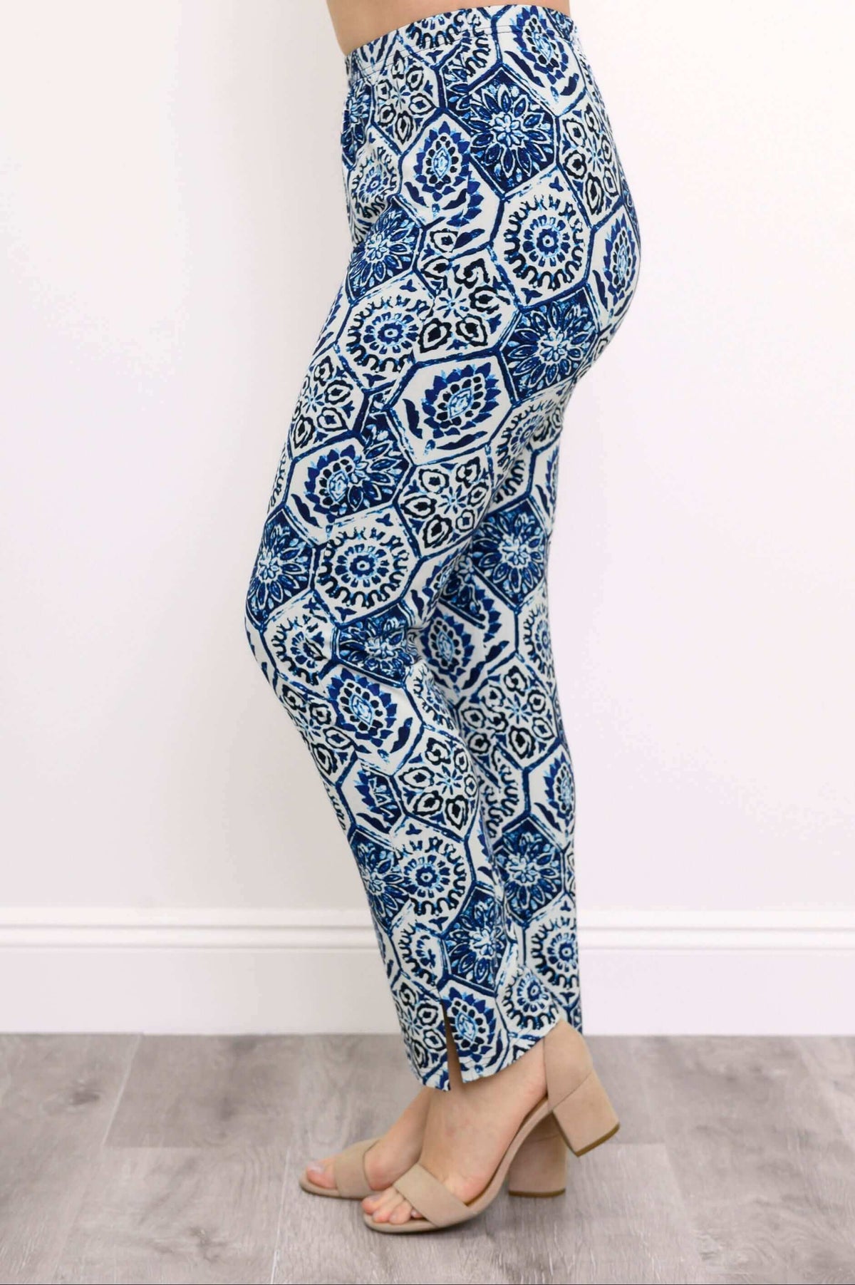 Side view of blue and white indigo mosaic slim pants with ankle slit