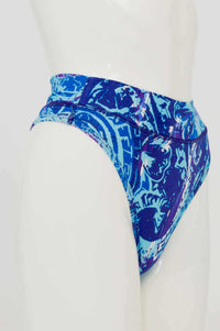 Side view of high rise bamboo thong showcasing blue abstract design