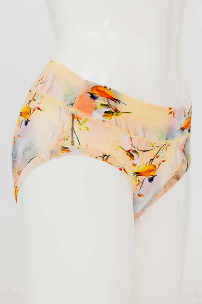 Side view of hipster bamboo brief featuring colorful songbird design