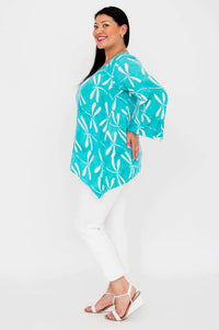 Side view of model in Dorothy aqua dragonfly print bohemian top
