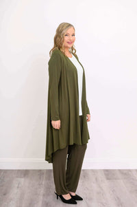 Side view of model in olive green bamboo duster cardigan and pants