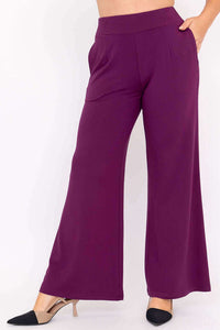 Side view of wide leg plum bamboo pants with pockets and two-tone heels