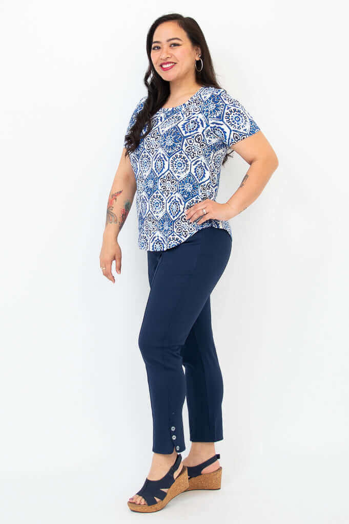 Side view of woman modeling Tessa Tee Indigo Mosaic and navy buttoned pants