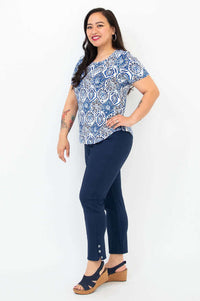 Side view of woman modeling Tessa Tee Indigo Mosaic and navy buttoned pants