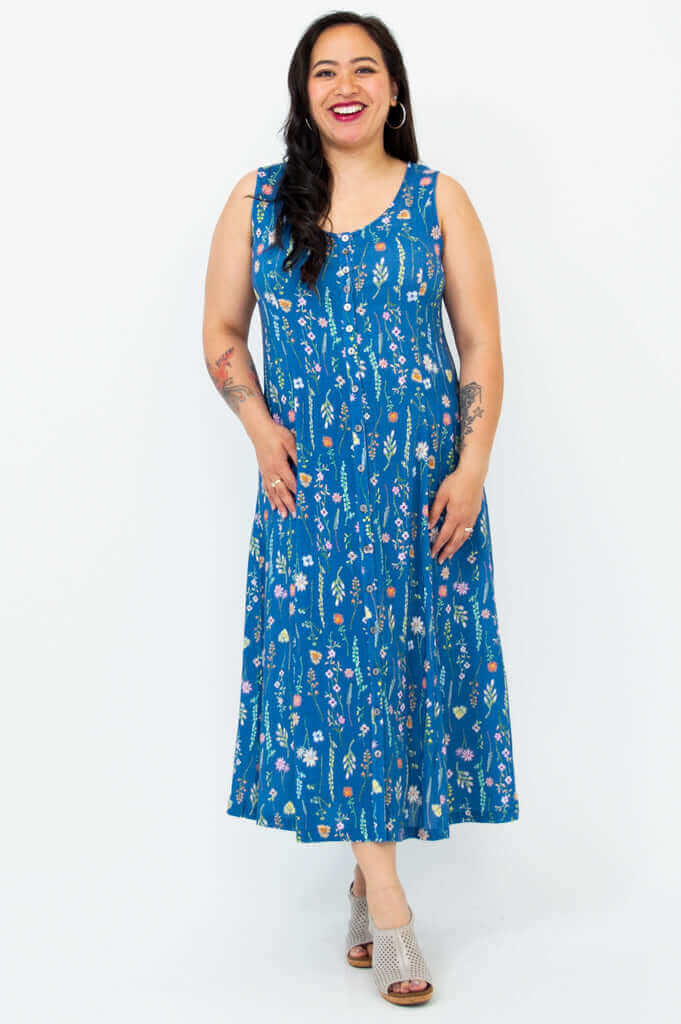Model showcasing the sleeveless Madison maxi dress in blue wildflower pattern