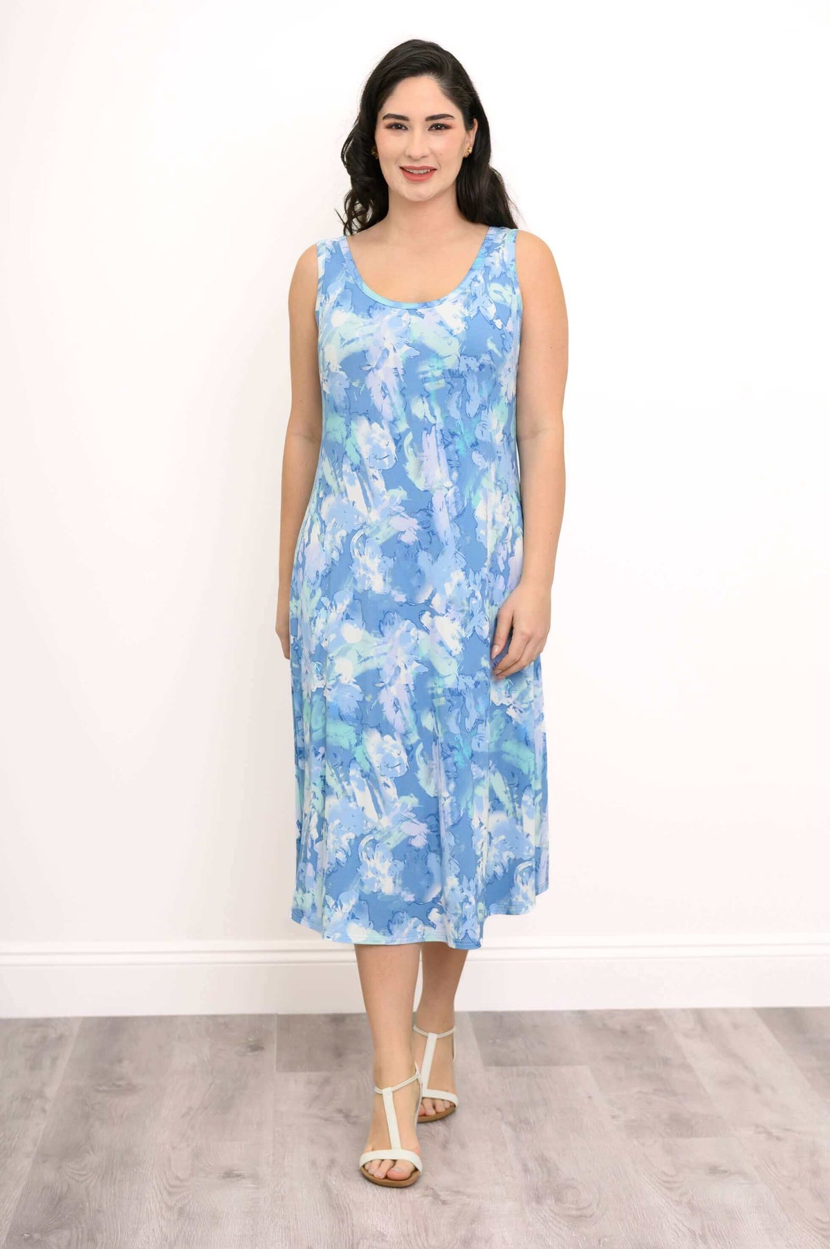 Woman modeling the sleeveless blue watercolor tank dress, facing forward