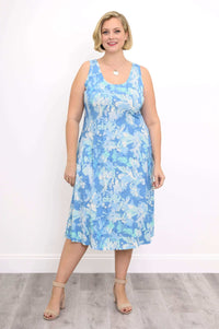 Woman wearing a sleeveless blue watercolor print tank dress, front view