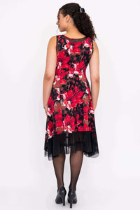 Back view of woman in sleeveless red floral A-line dress with mesh hem
