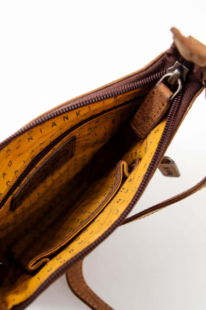 Detailed view of the spacious lined interior with slip pockets inside the pouch