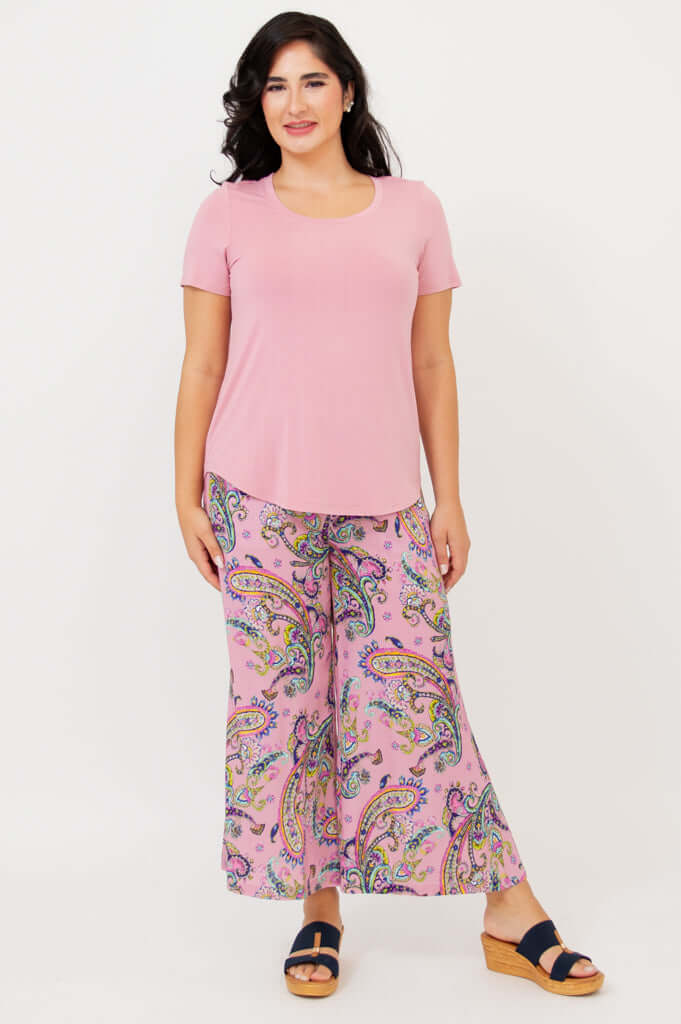 Model standing in Tessa Tee and paisley pants, hands by her sides