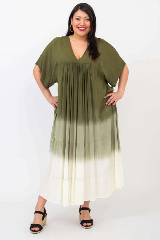 Front standing pose of woman in olive green ombre maxi dress with flowy tiers