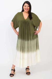 Front standing pose of woman in olive green ombre maxi dress with flowy tiers