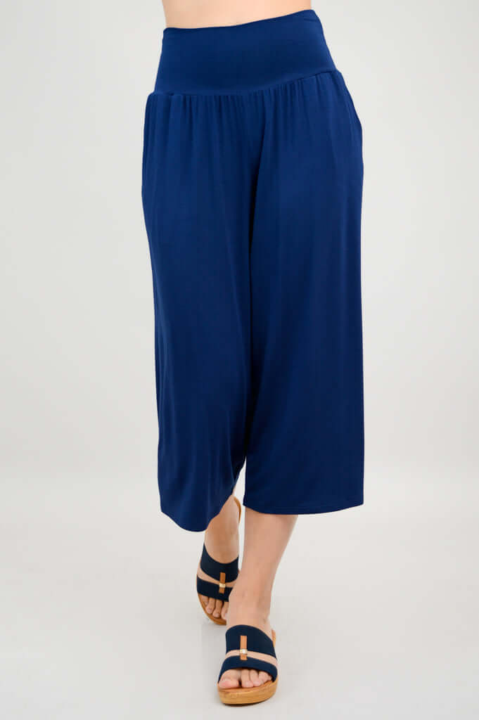 Stepping pose in gaylene bamboo capri pants, royal blue, wide-leg palazzo style
