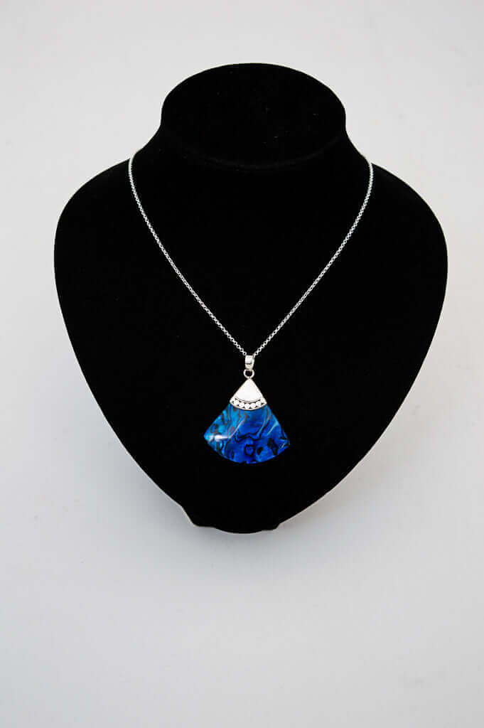 Sterling silver and blue abalone fan pendant necklace displayed on black stand