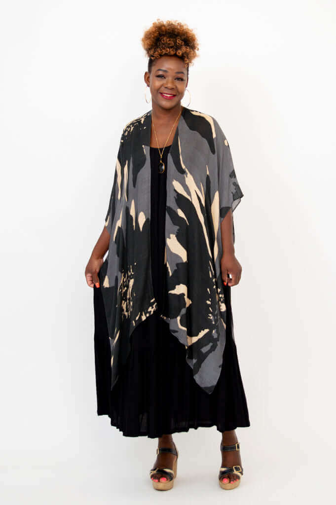 Straight-on view of woman modeling Darcy kimono wrap over black maxi dress