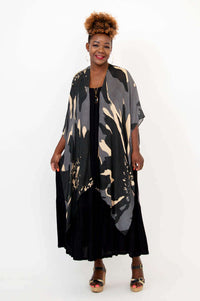 Straight-on view of woman modeling Darcy kimono wrap over black maxi dress