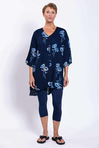 Straight front view of woman modeling navy blue Darla blouse with floral print