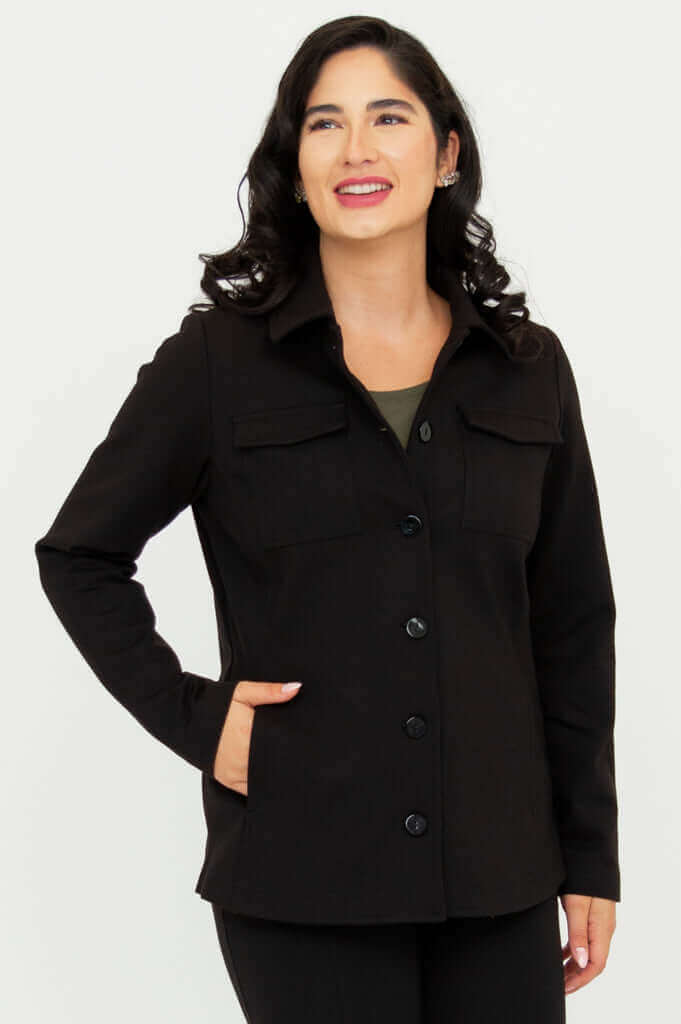 Model wearing tailored black jacket with front buttons and shirt collar