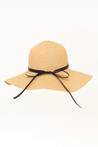 Tan sun hat with black ribbon bow, shown from the back