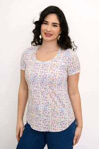 Woman wearing a Tessa Tee in confetti dot print, short sleeves and scoop neck