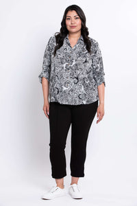 Full front view of model in The Wendy black and white patterned blouse and black pants