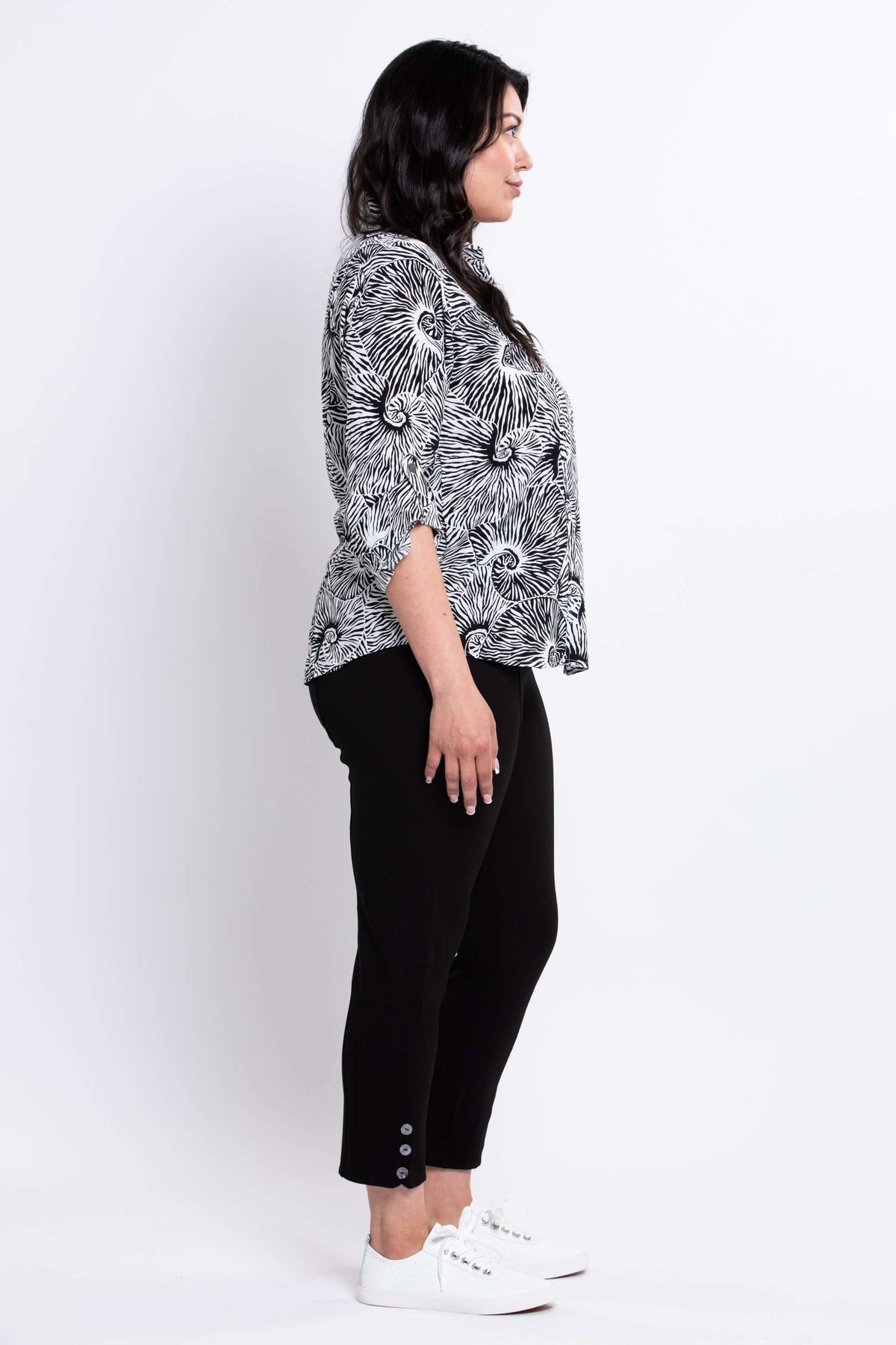 Side profile of model wearing The Wendy blouse with collar and tabbed sleeves