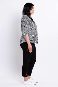 Side profile of model wearing The Wendy blouse with collar and tabbed sleeves